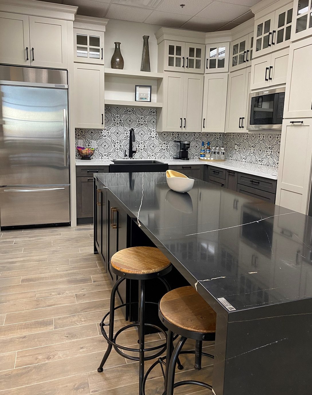 A new full-sized state-of-the-art working kitchen is going in right now complete with stunning waterfall countertops, plenty of cabinet storage space, voice activated faucet, upgraded hardware and appliances.