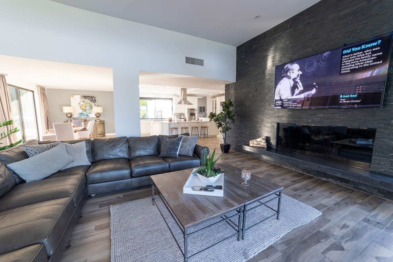 Cultured stone panels from floor to ceiling give this Family Room a whole new modernized and masculine look. [TWD Project Location: Litchfield Park, AZ]