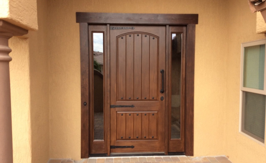 Thermatru stained entry door with side lites and bronze hardware for a grand entrance. [TWD Project Location: Sun City West, AZ]