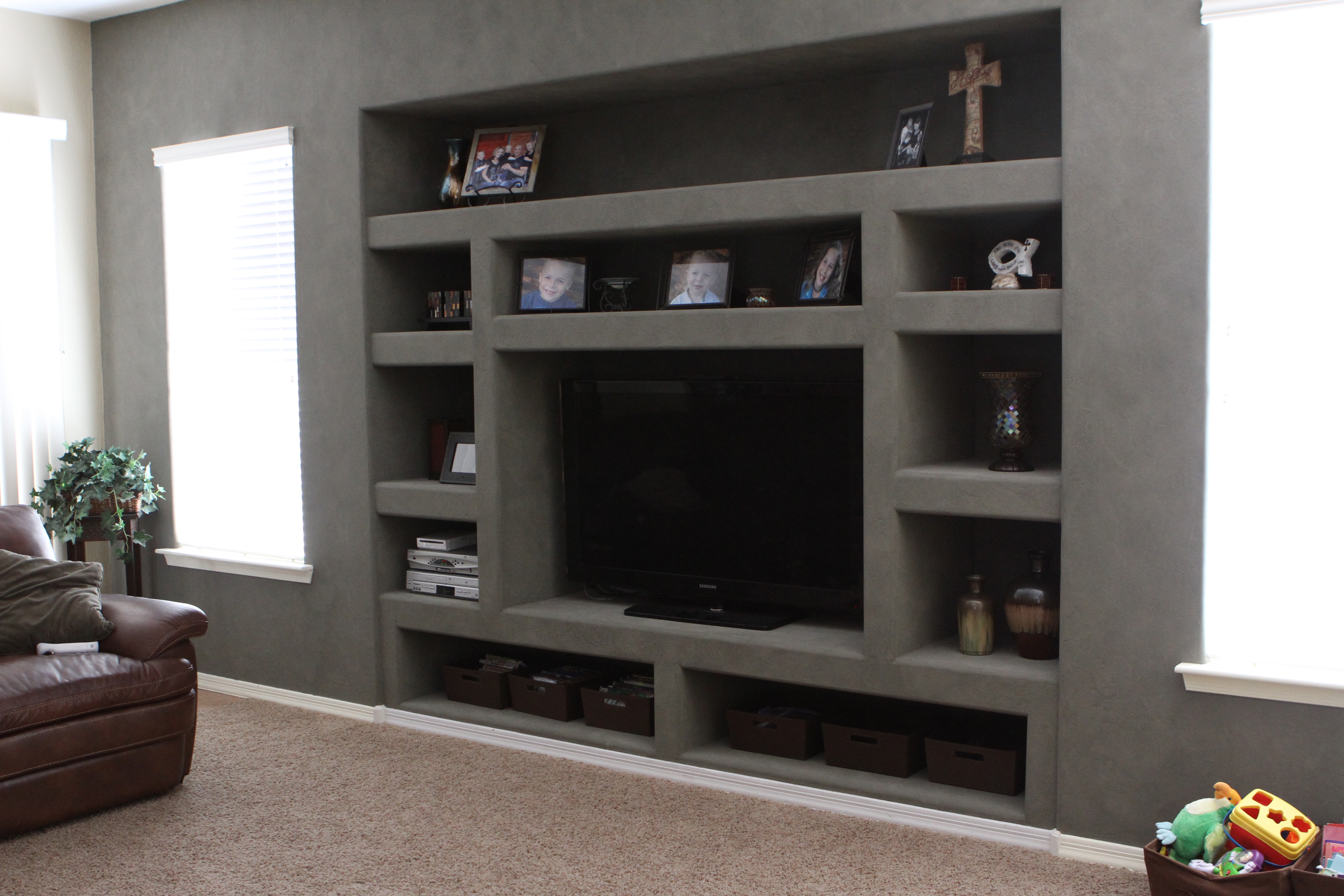 Traditional built-in drywall media wall with plenty of niches to display family heirlooms and photos. [TWD Project Location: Surprise, AZ]