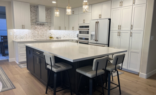 When a fantastic design and stunning material choices come to life, it produces a magazine worthy kitchen in this instance. This glamorous style features Waypoint Living Spaces cabinetry, polished quartz countertops, marble tile, gold fixtures and hardware, as well as new engineered hardwood flooring to perfectly complete the look. [TWD Project Location: Phoenix, AZ]