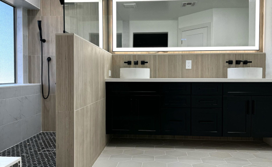 This Master Bathroom renovation turned an ordinary bath into a fabulous spa-like retreat that the homeowners are absolutely loving. The natural light from the window and LED backlit mirrors really brighten up the space, while the mix of tile textures and patterns create a cohesive natural feel. [TWD Project Location: Surprise, AZ]