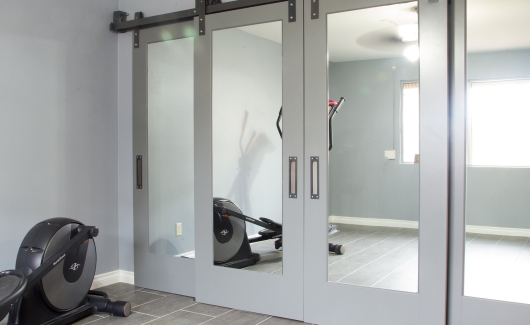 Gorgeous Master Suite Remodel featuring shaker recessed panel interior sliding barn doors with raw steel barn door track and 12" x 24" porcelain tile. [TWD Project Location: Glendale, AZ]