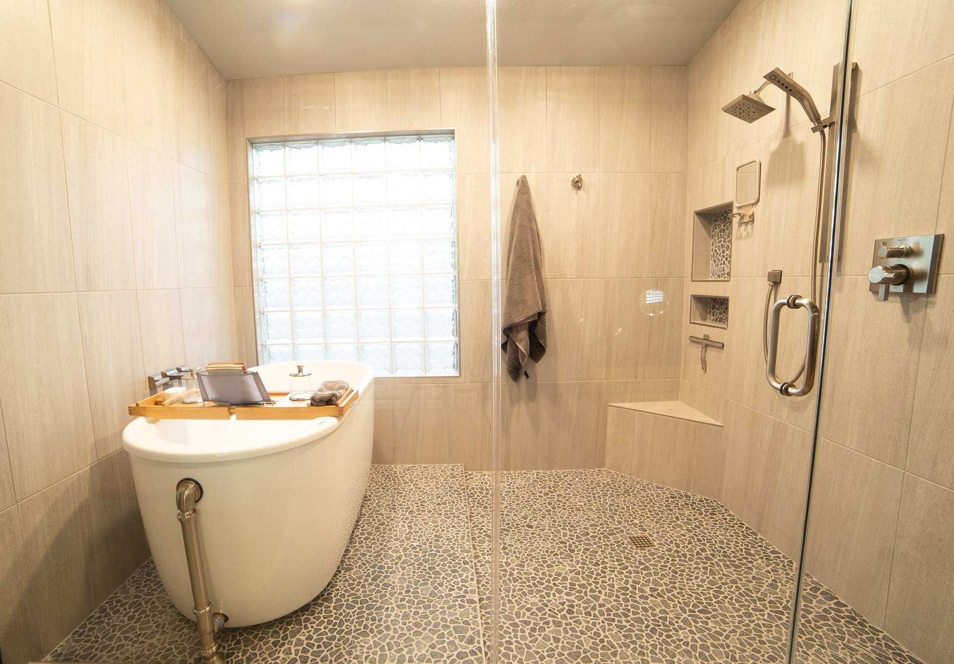 Our team had the pleasure of working with this amazing couple that had big ideas for their Master Bathroom design. This gray and black scheme has a modern, yet masculine feel to it, while incorporating all of the spa-like features for her. [TWD Project Location: Chandler, AZ]