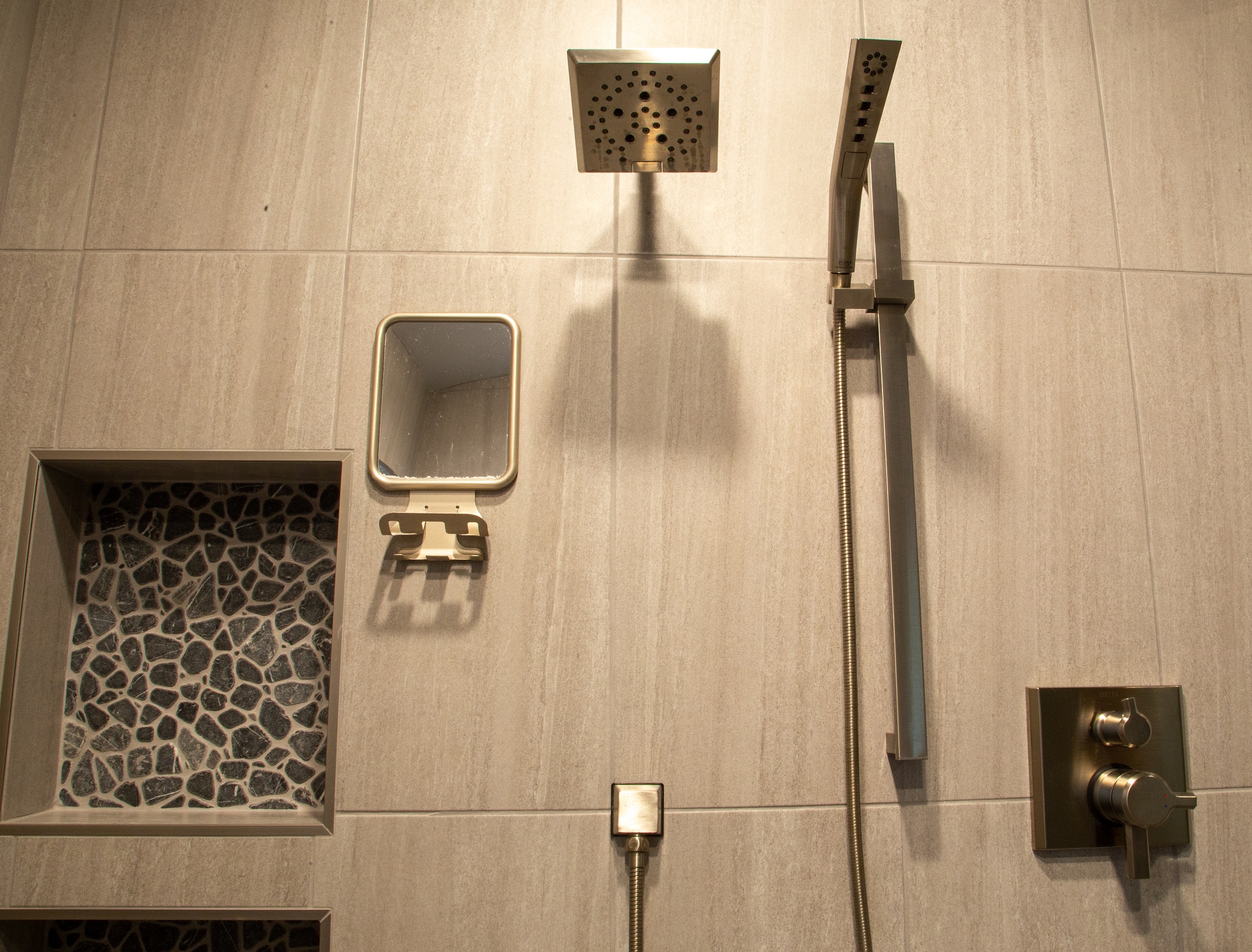 Our team had the pleasure of working with this amazing couple that had big ideas for their Master Bathroom design. This gray and black scheme has a modern, yet masculine feel to it, while incorporating all of the spa-like features for her. [TWD Project Location: Chandler, AZ]