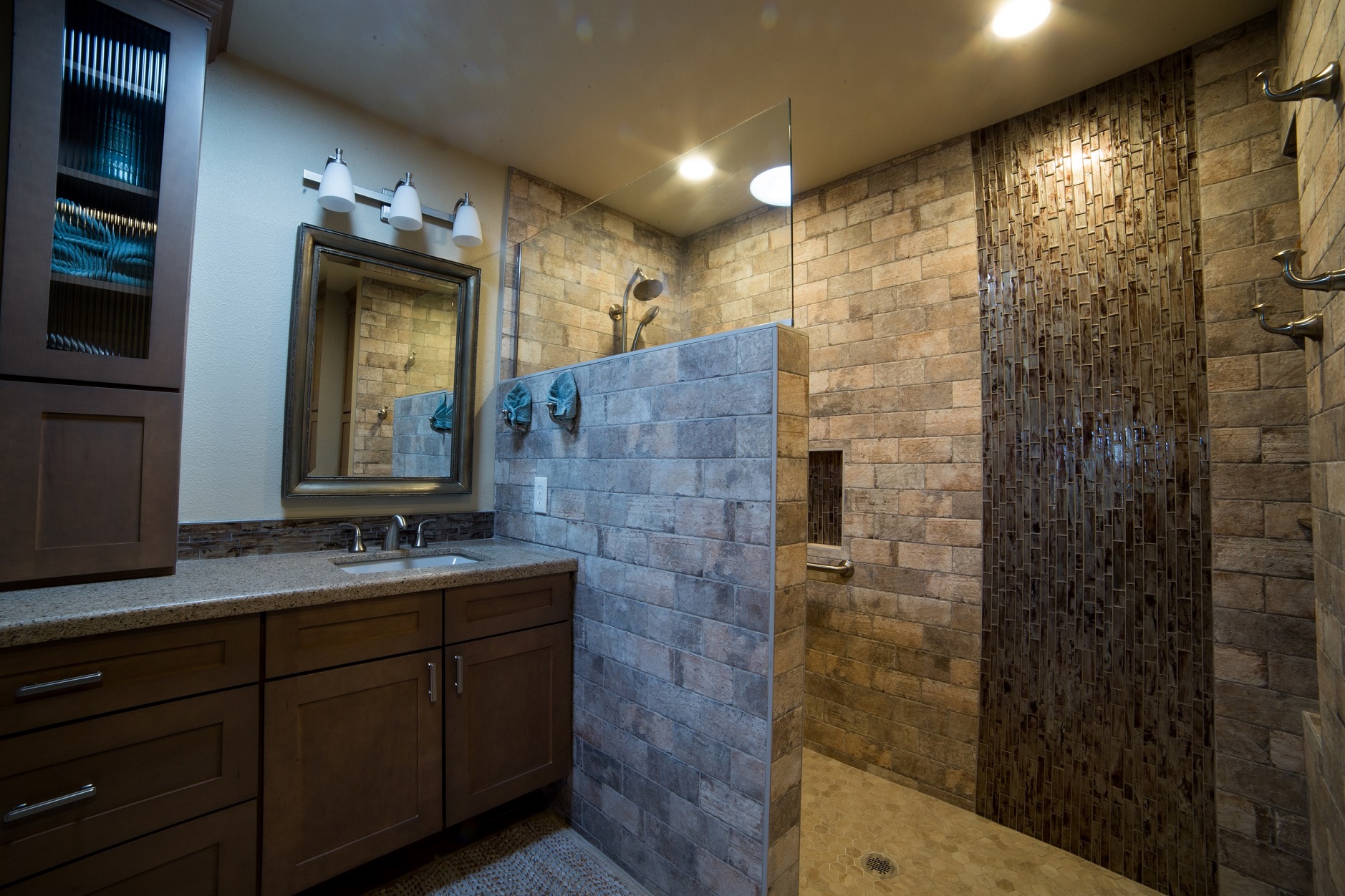 While a beautiful complete Master Bathroom remodel, the real main attraction is the zero threshold spacious walk-in shower covered in Chicago Brick Southside porcelain tile. [TWD Project Location: Sun City West, AZ]