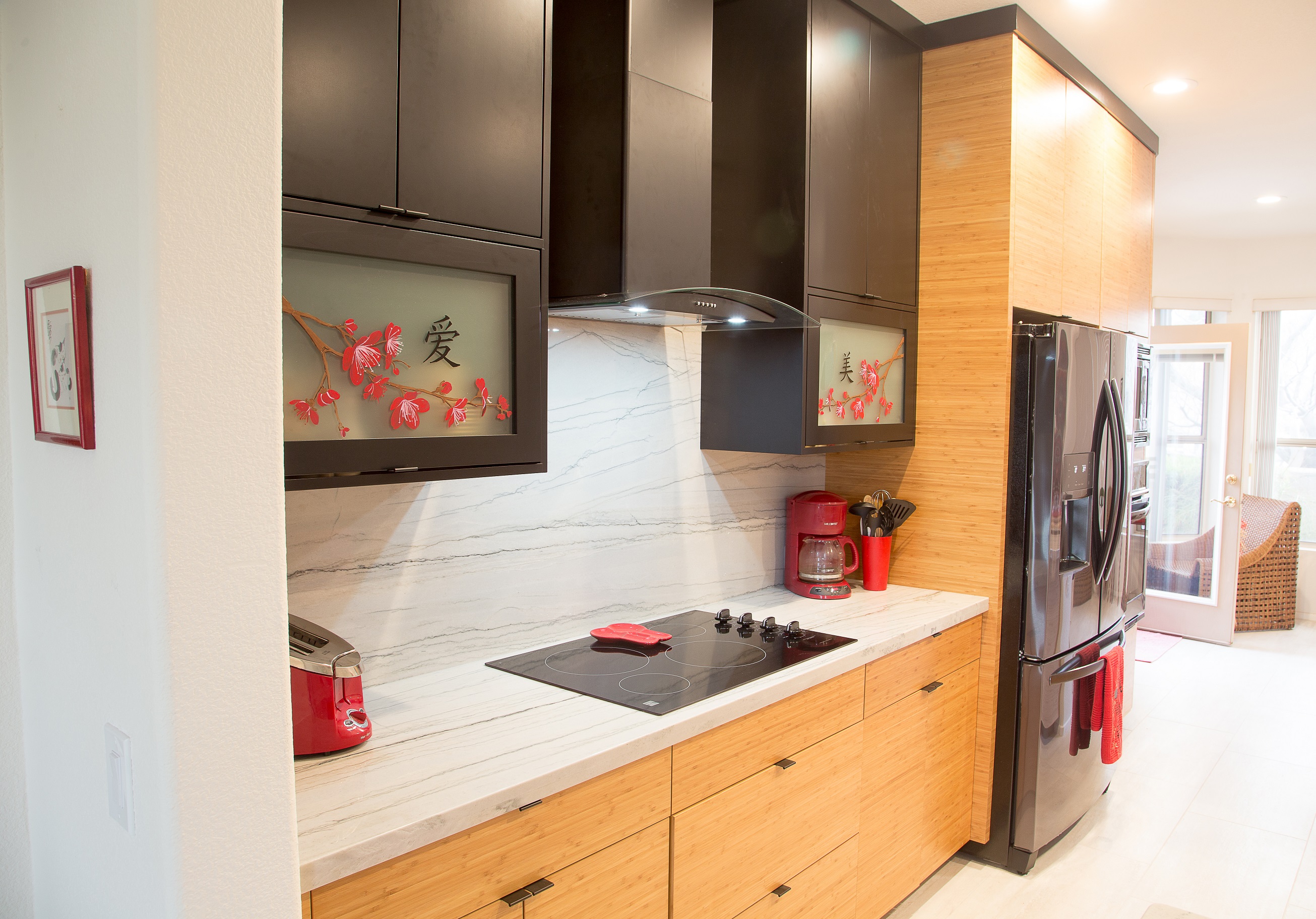 TWD was honored to work with this Valley homeowner to bring her 10-year vision to life! Featuring custom bamboo cabinetry, black cabinetry with glass inserts, the most stunning and carefully selected slabs around, and the finite details of this project all came together beautifully. [TWD Project Location: Surprise, AZ]