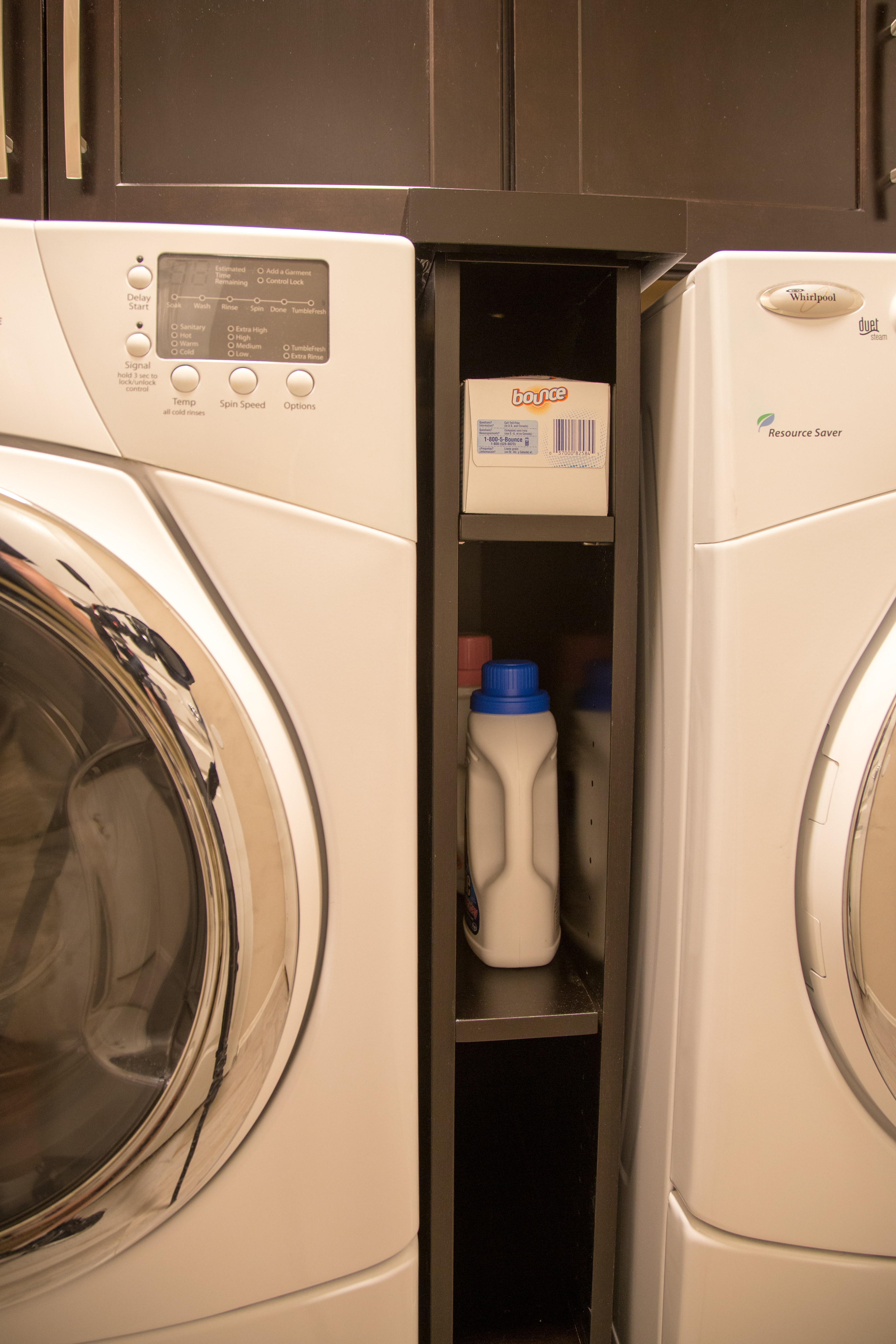 Specialty cabinets and shelving in the laundry room are ideal for any family. [TWD Project Location: Glendale, AZ]