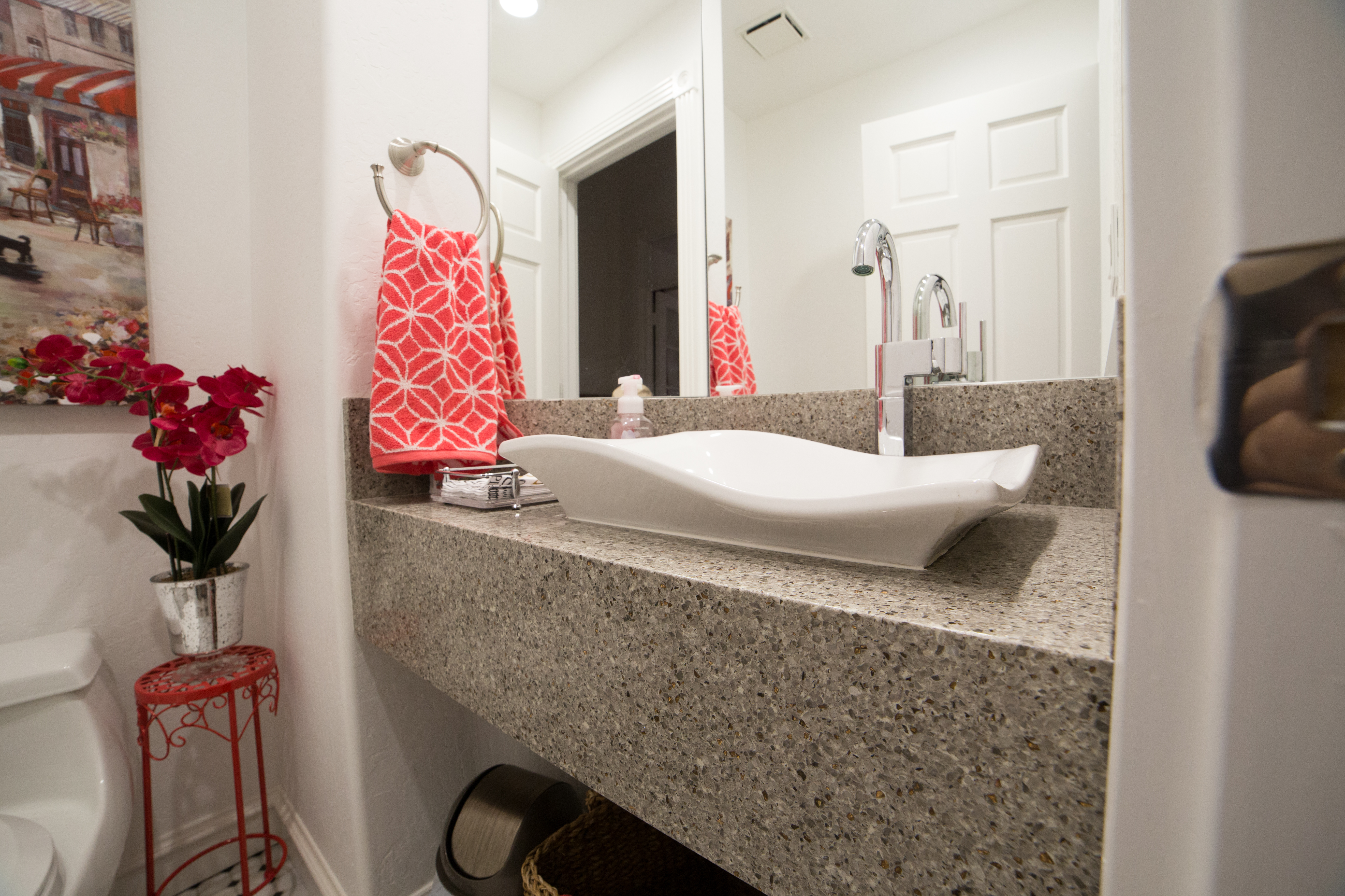 Imperial Gray Quartz countertop and backsplash with the clean look of a white vessel sink makes this guest bathroom pop. [TWD Project Location: Glendale, AZ]