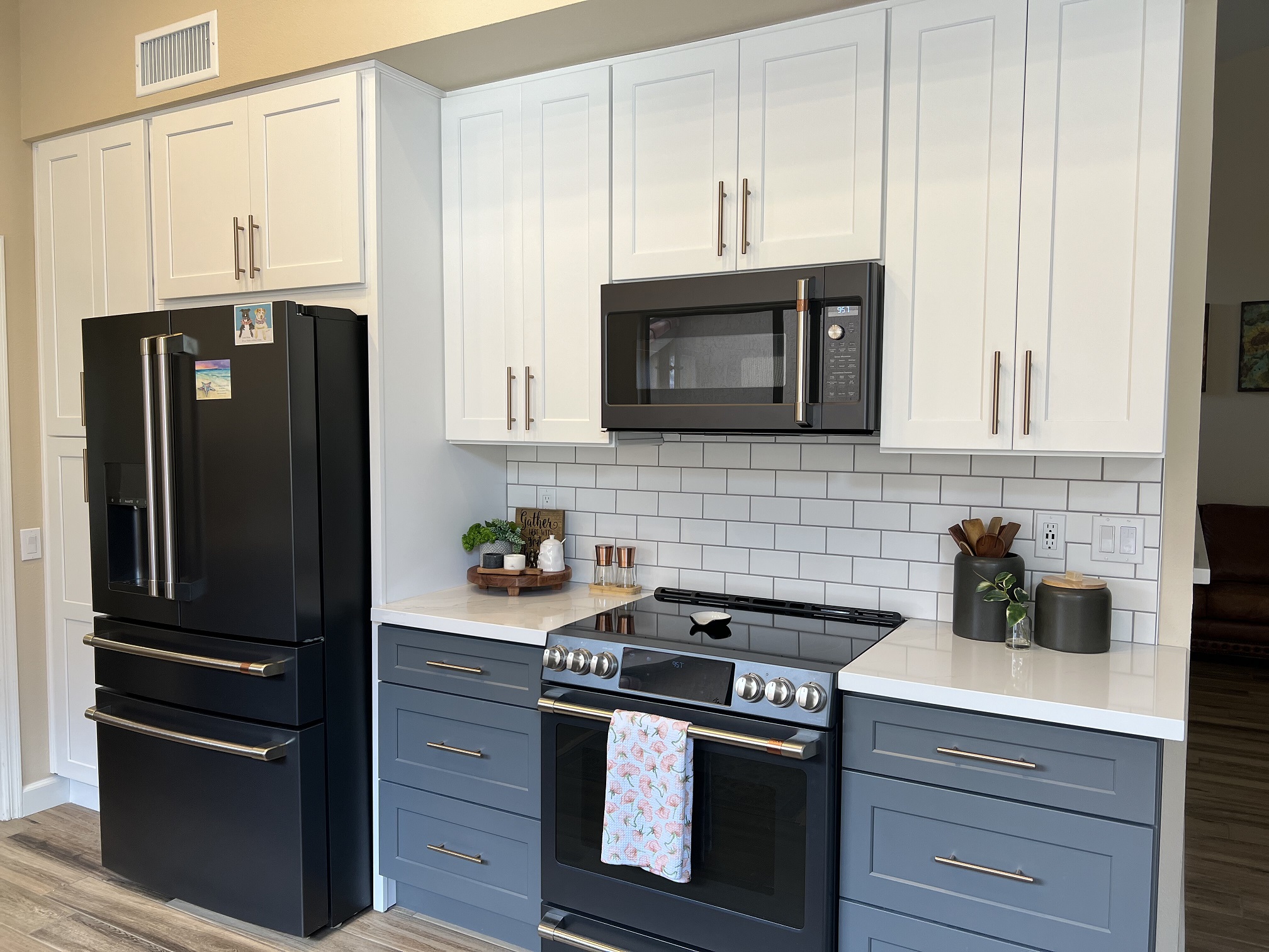 Two-toned gray and white shaker cabinets give this Kitchen remodel project a boost of character. [TWD Project Location: Sun City West, AZ]