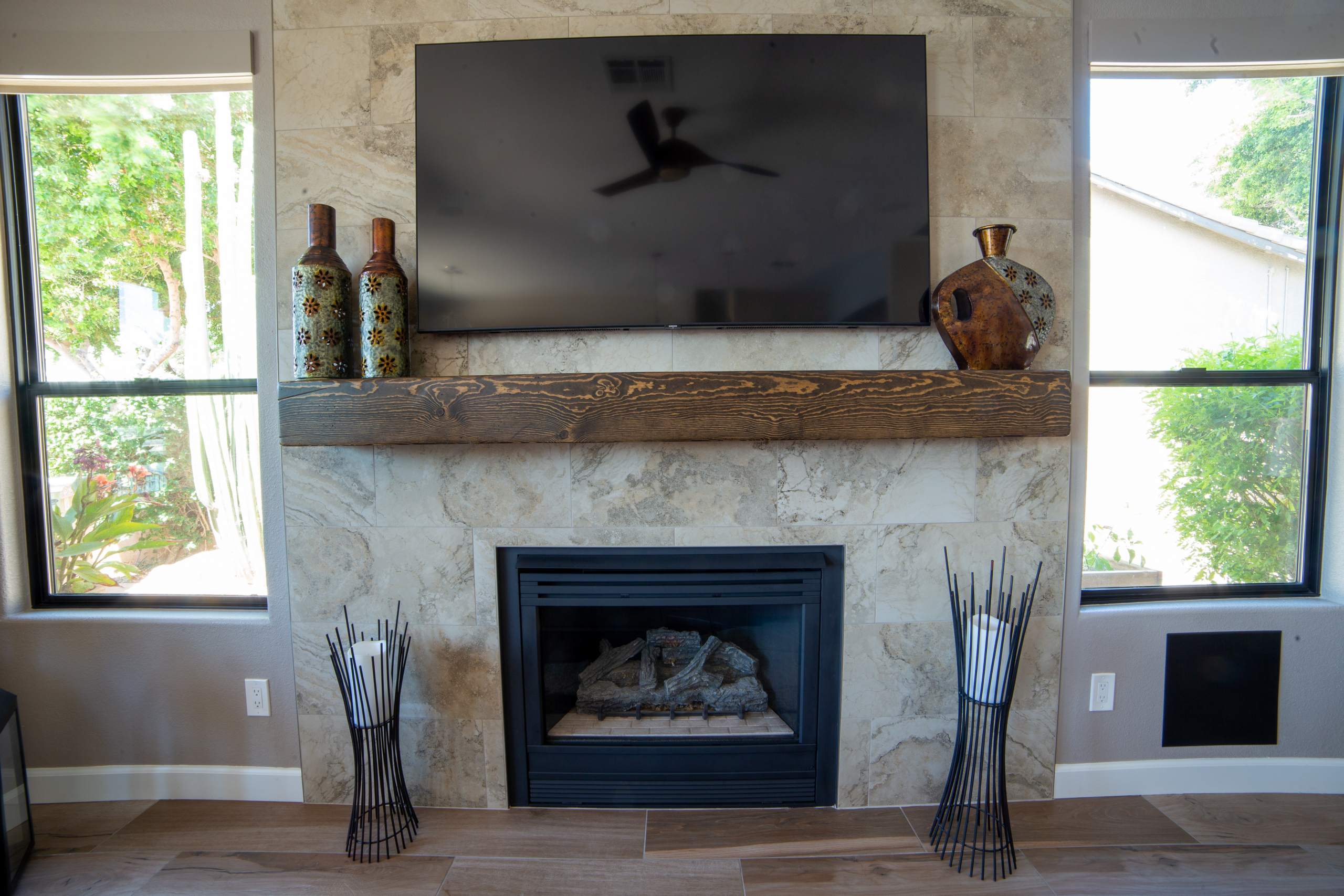 12" x 24" tile fireplace surround from floor to ceiling with a custom built 60' wide mantle. [TWD Project Location: Glendale, AZ]