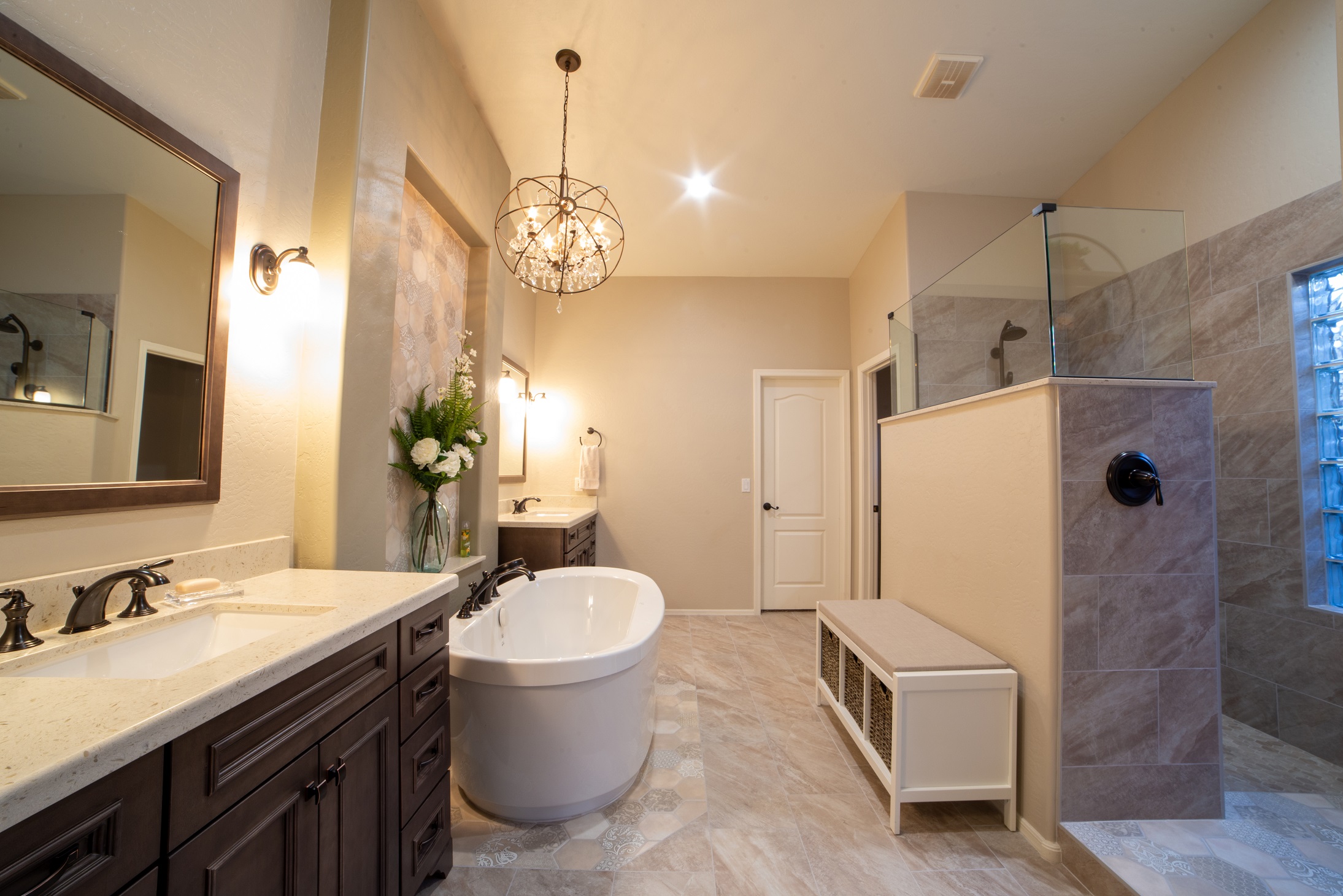 From an ordinary bathroom to a stunning master bathroom to love. This remodel features separated Wellborn vanities, a spacious walk-in shower with drying area, and a soaking tub carefully placed upon gorgeous hexagon mosaic tile to complete this magazine worthy look.  [TWD Project Location: Peoria, AZ]