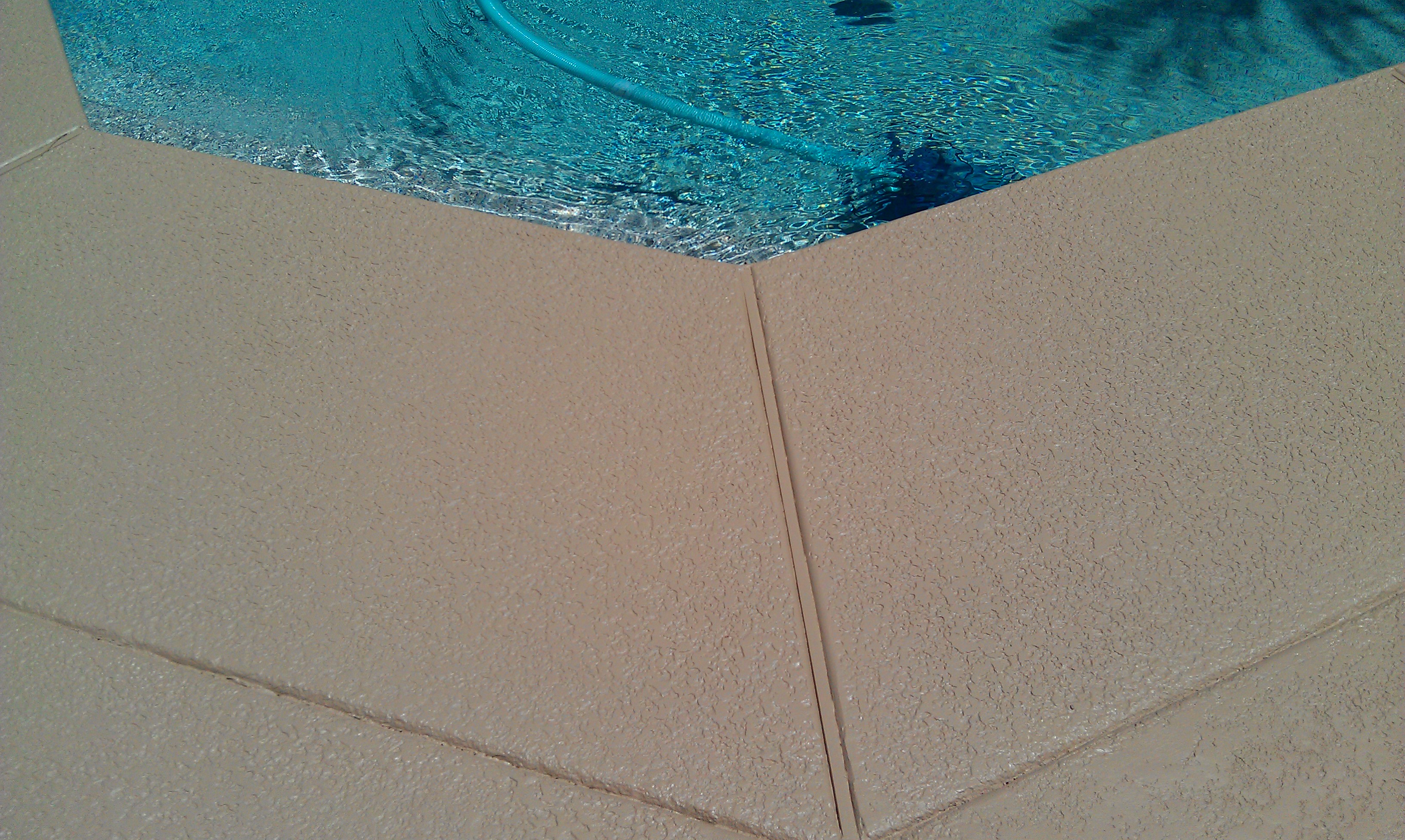 TWD can help spruce up around your pool and other concrete surfaces. [TWD Project]