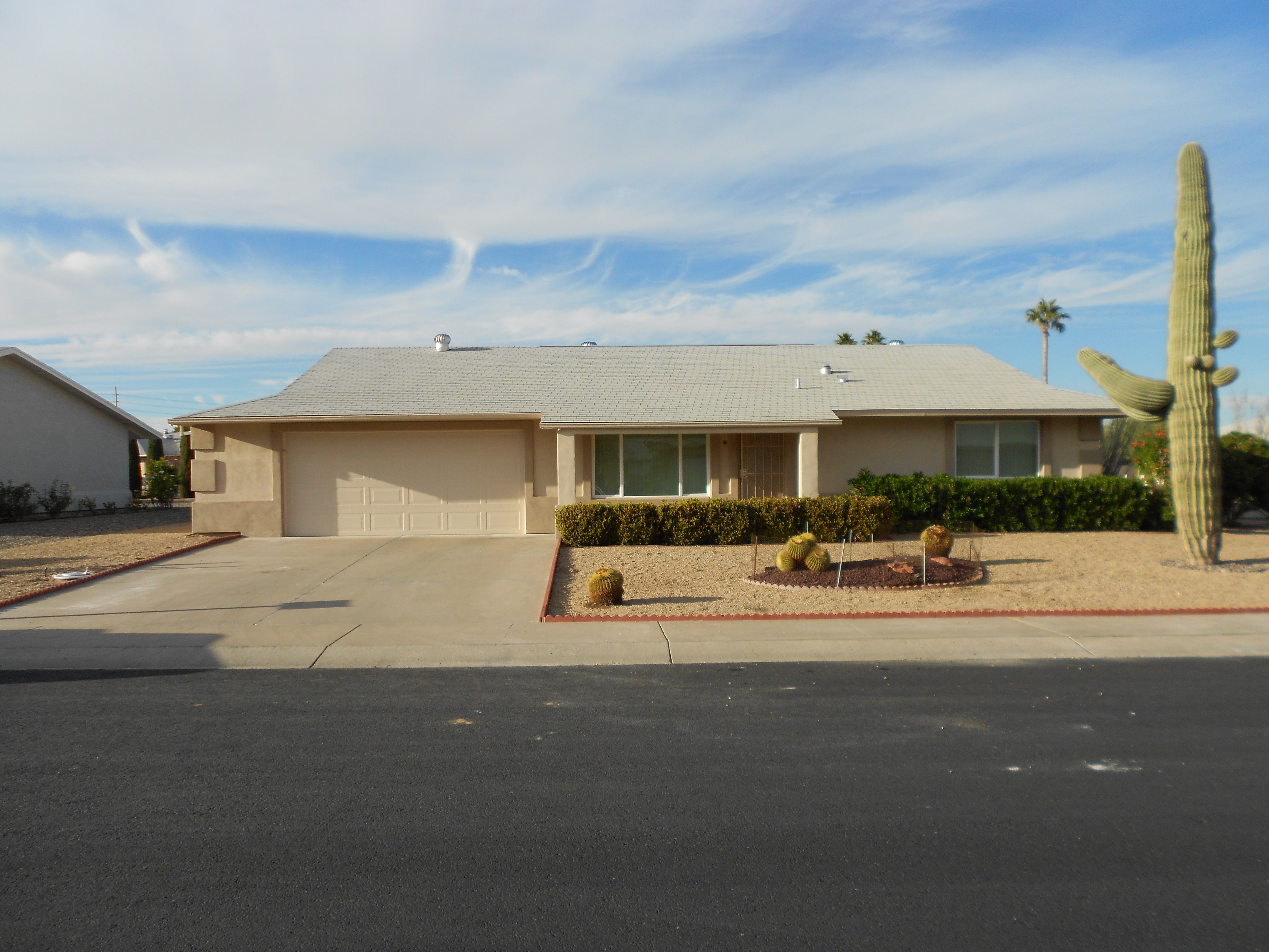 Being built originally with red brick, this home was in need of a cosmetic makeover. Performing a full stucco wrap on this home with bulked up stucco entry columns and decorative pop-outs at the windows and the sides of the home, this home doesn't even look like the same house. [TWD Project Location: Sun City, AZ]