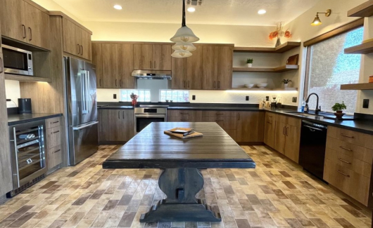 This kitchen checks all the boxes of warmth and texture. This space features Wellborn's aspire frameless cabinetry, Bedrosian porcelain floor, and bohemian flame countertops. [TWD Project Location: Peoria, AZ] 