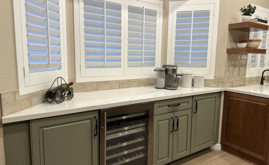 This farmhouse style kitchen remodel included a built-in bar area using Wellborn Cabinet Select series in Olive color with a Monteray door style. [TWD Project Location: Phoenix, AZ]