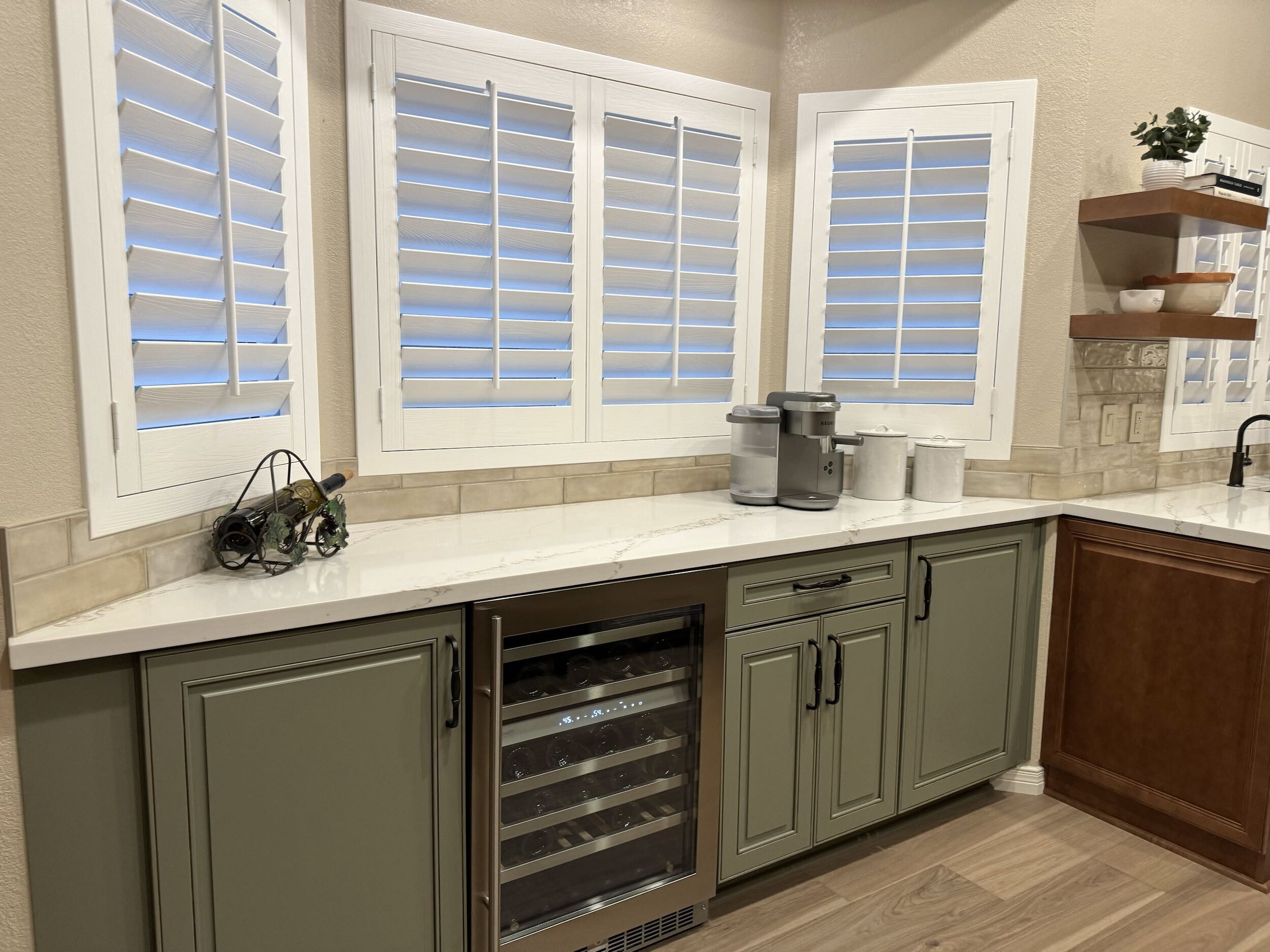 This farmhouse style kitchen remodel included a built-in bar area using Wellborn Cabinet Select series in Olive color with a Monteray door style. [TWD Project Location: Phoenix, AZ]